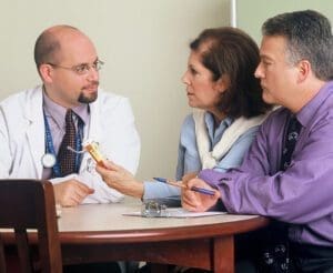 - 17328 a doctor and couple talking pv e1636803086843